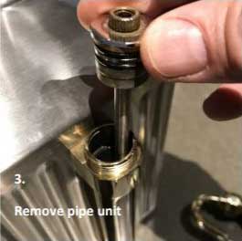 Removing the pipe unit from the pressurized growlers sight glass tap assembly.