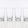 Set of 4 empty nonic 19oz imperial pint glasses in a row.