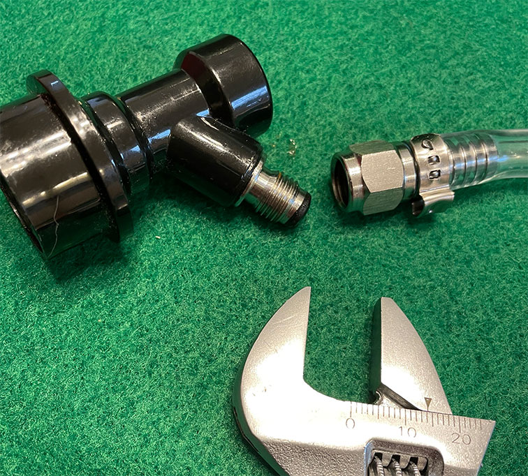 Ball lock fittings taken apart with wrench