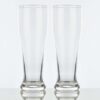 2 classic pilsner glasses side by side on a white background.