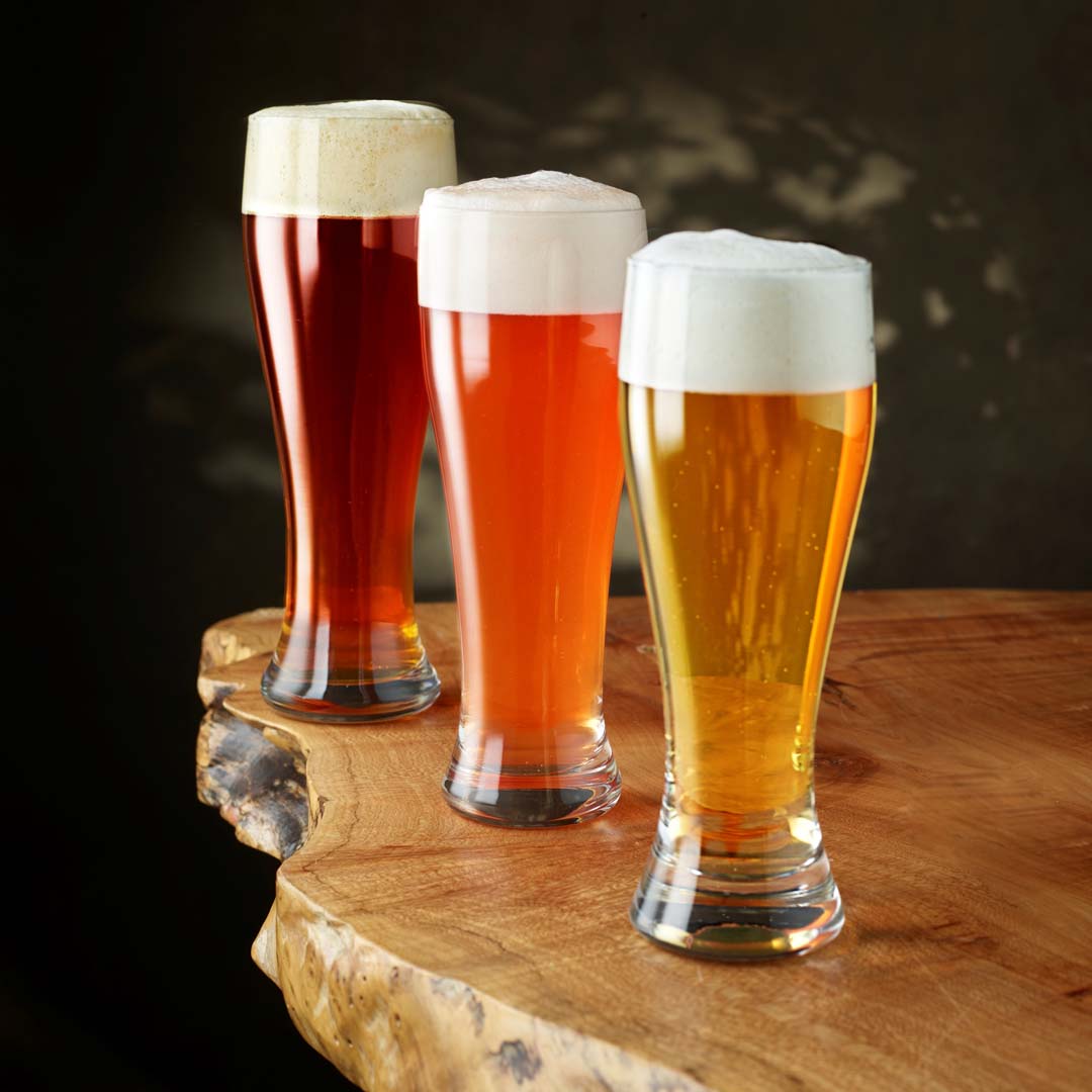 https://www.craftmastergrowlers.com/wp-content/uploads/2023/02/3-24oz-jumbo-pilsner-glasses-with-beer.jpg