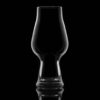 footed baloon glass, backlit on a black background. This is the perfect glass for an IPA.
