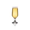 8.75oz footed beer glass on a white background filled with beer.