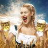 German woman holding 2 mugs of beer in 19oz Oktoberfest stein style mugs.