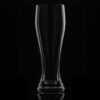 Classic 17oz American pint, pilsner glass on a black background and backlit.