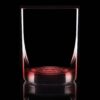 11.75 oz red bottom glass on a black background and backlit.
