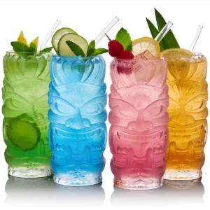 4 colored warrior style tiki glasess with cocktails.